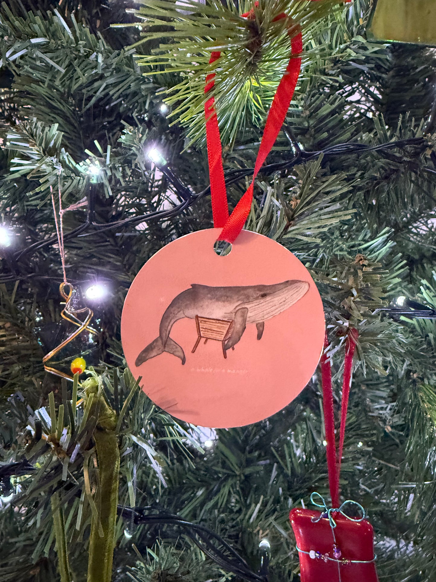 A Whale in a Manger Christmas Bauble