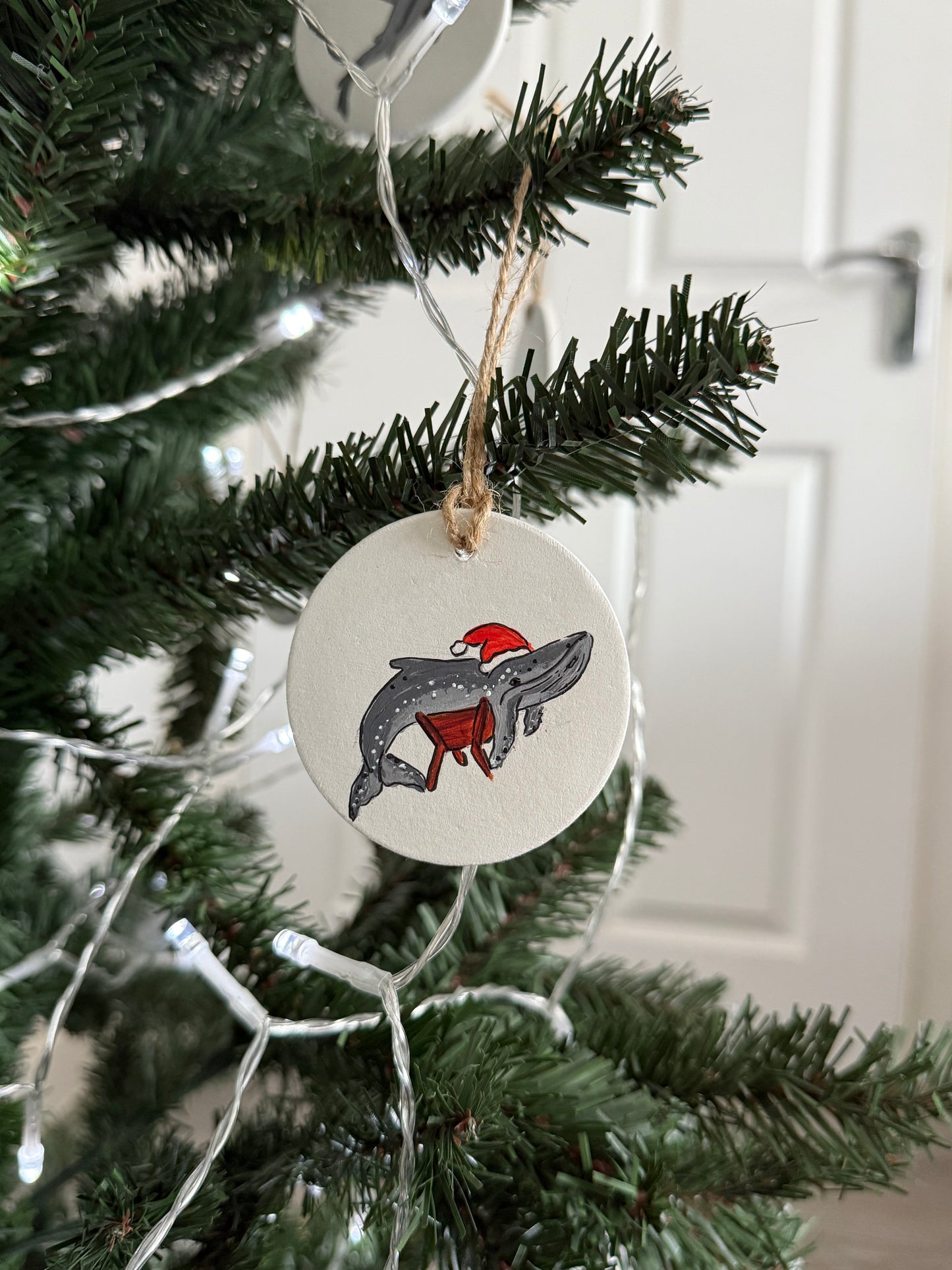 A Whale in a Manger Christmas Bauble