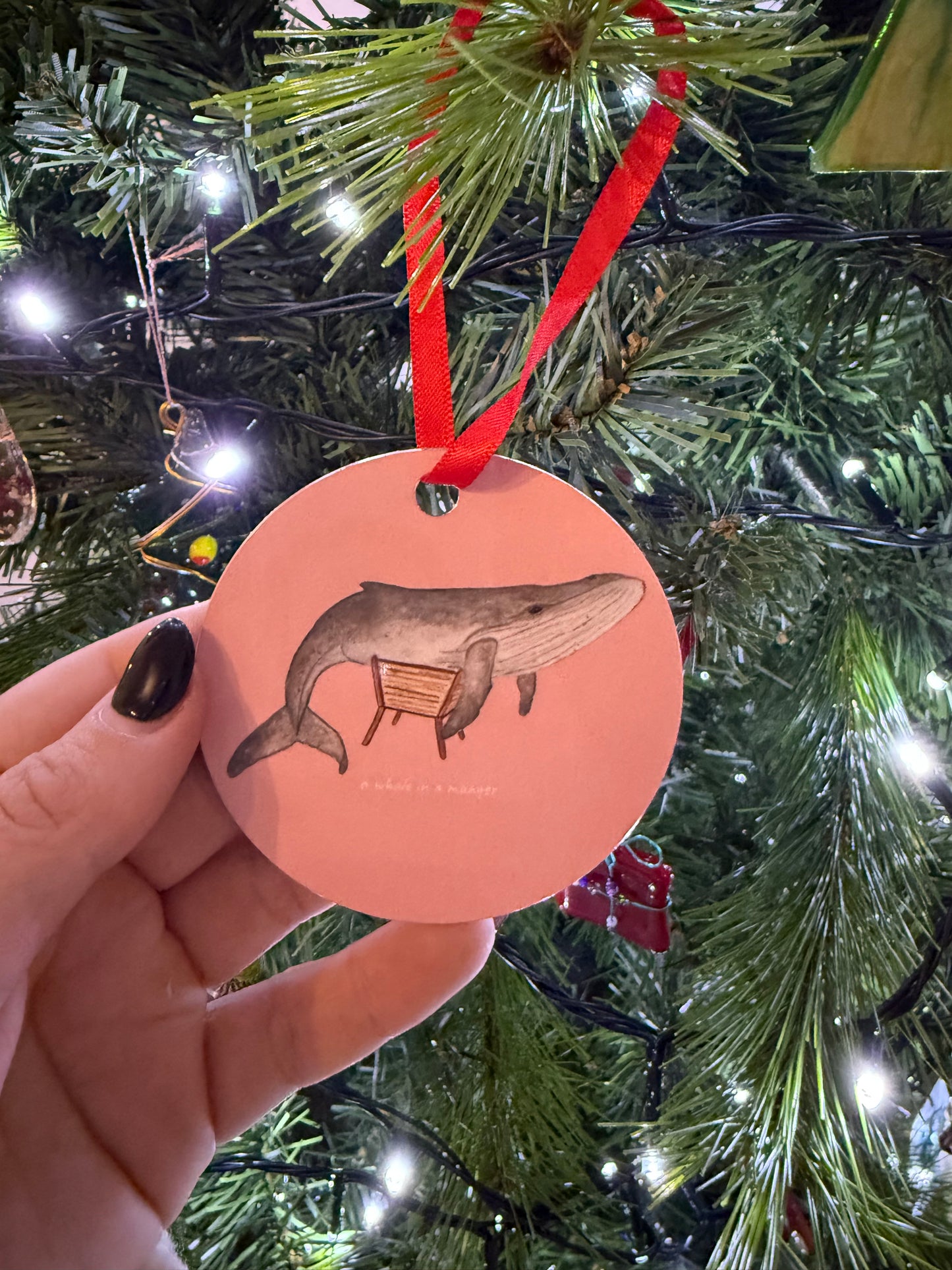 A Whale in a Manger Christmas Bauble