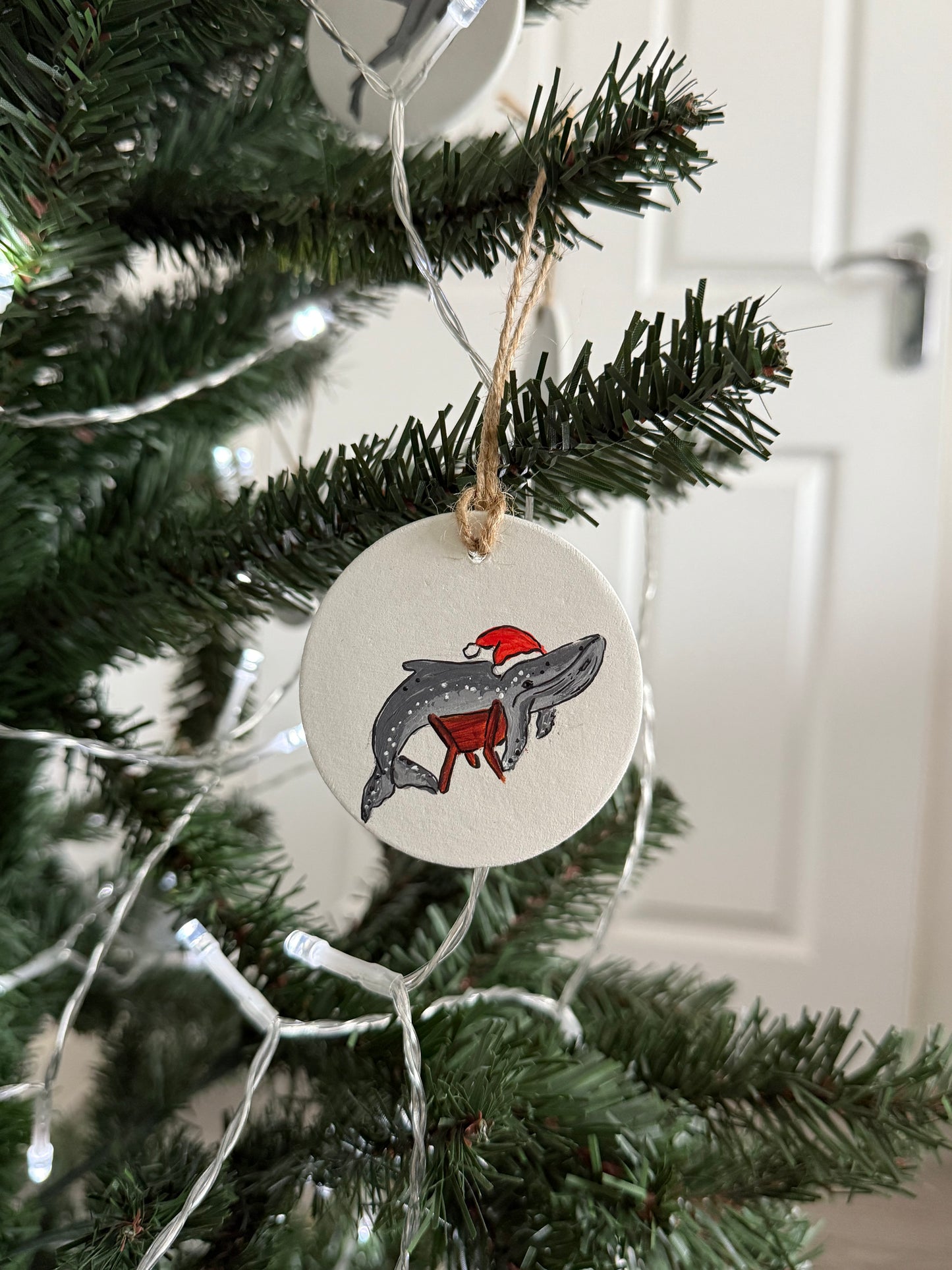 A Whale in a Manger Christmas Bauble